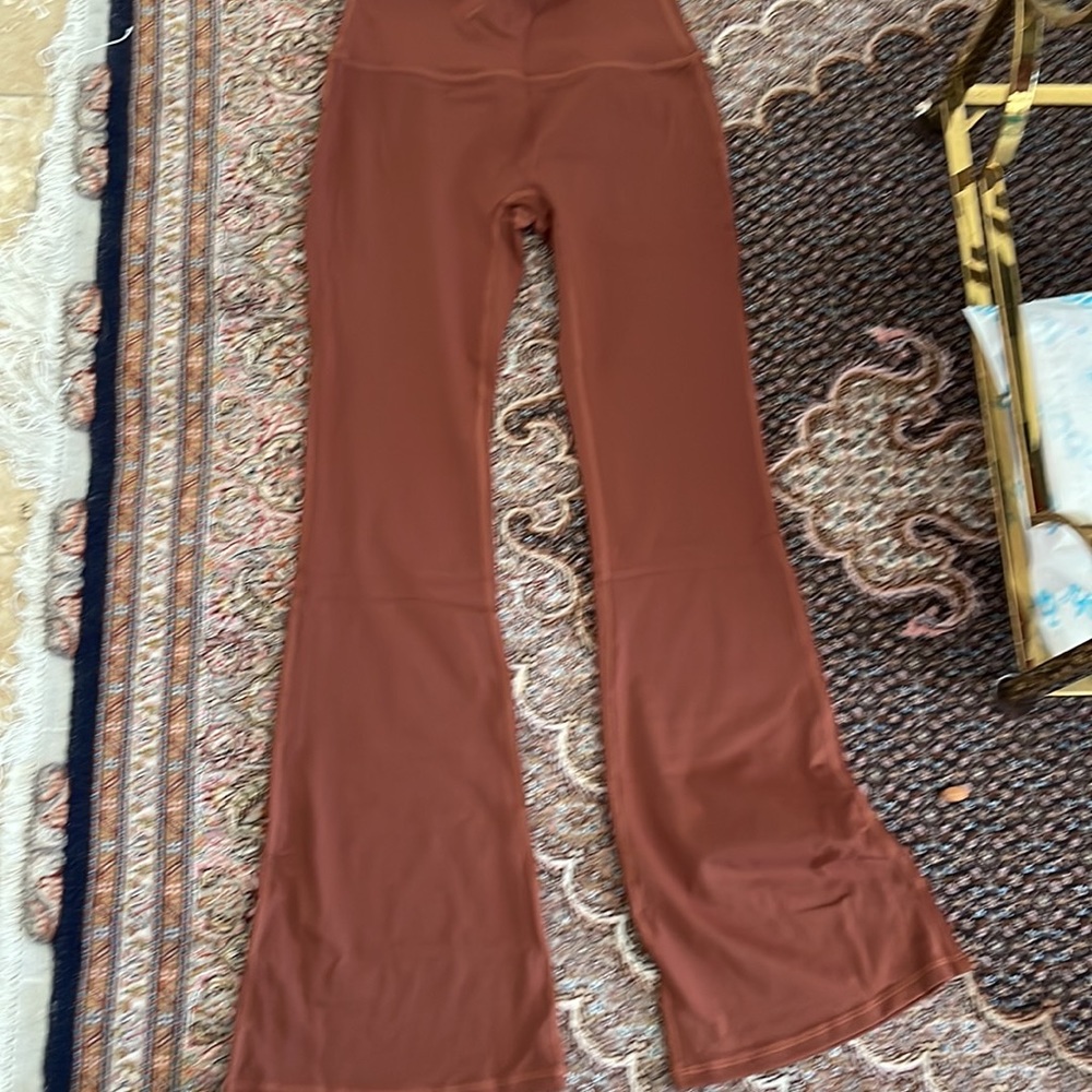 HIGH WAISTED FLARE PANTS There are more color . We have black . Navy and brown